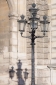 Lamp post and shadow at the Louvre, Paris