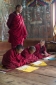 Monastery Lama and young novice monks in a monastery above the Tiger's Nest, near Paro, Bhutan