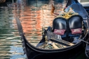 Gondola against colorful reflections, Venice