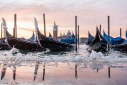 Acqua alta high tide and gondolas in St. Mark's Basin, Venice, at dawn