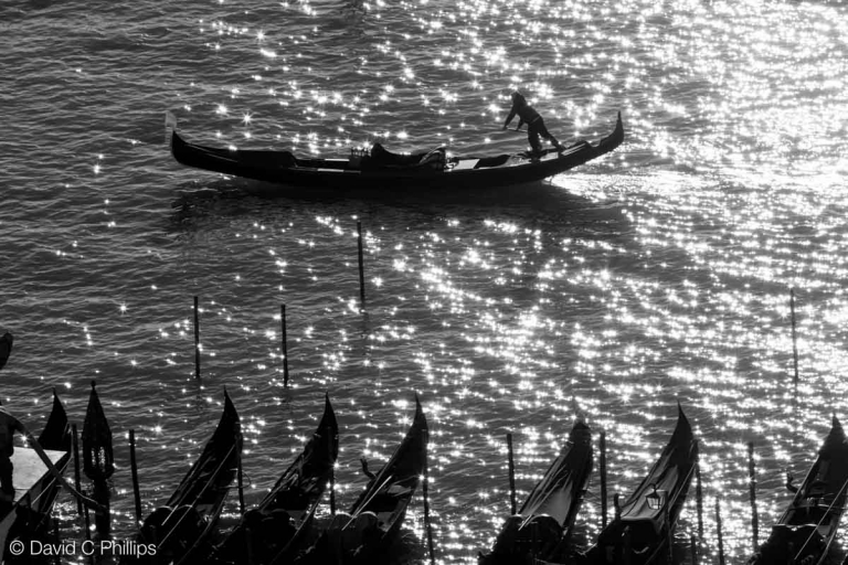 Gondolier silhouetted, from the Campanile