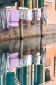 Clothes on the line reflected in Venice canal