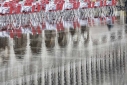 Tables and chairs reflected in St. Mark's Square, Venice, acqua alta