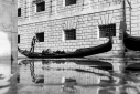 Gondola and reflections during high tide flooding, Venice