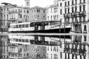 Vaporetto and reflections, Grand Canal Venice during acqua alta high tide flooding