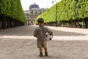 Young aspiring footballer, Palais Royal gardens, Paris
