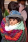 Baby on mother's back in Cusco, Peru