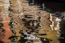 Abstract reflections in browns and orange, Venice