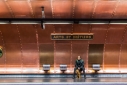 Man and dog waiting for the train at the Arts et Métiers Metro station, Paris