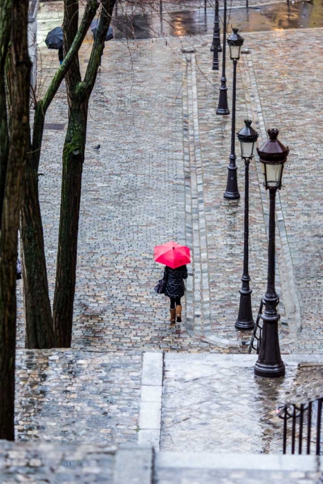 The red umbrella on the steps of Montmartre, Paris