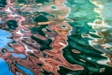 Reflections under a bridge in Venice